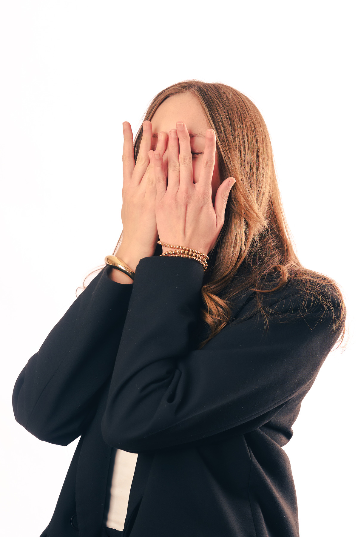 Editorial headshot of a professional woman in a black blazer on a white backdrop — The Modernist Studios, Austin TX