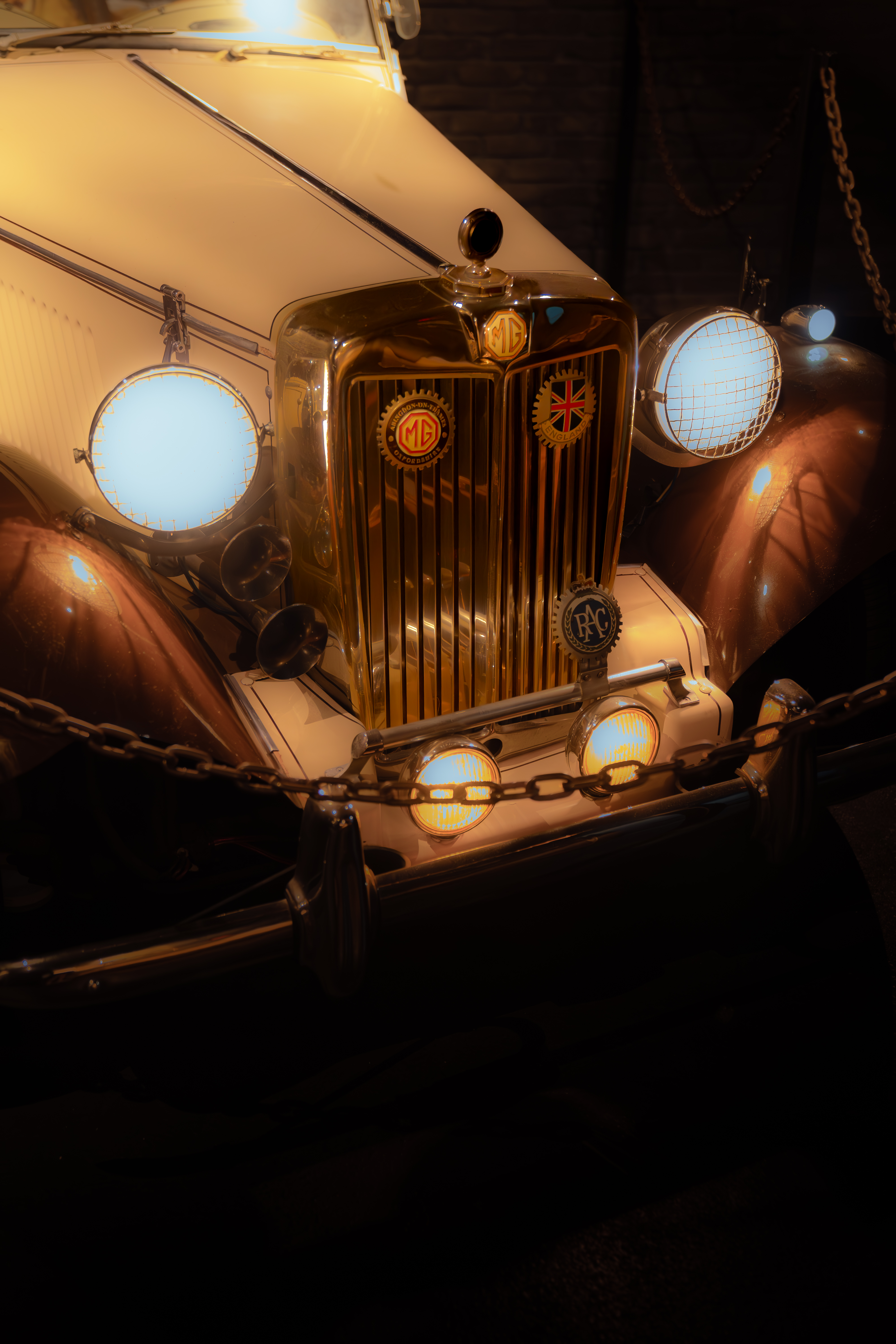Chrome grille of a vintage MG car displayed inside The Bunker