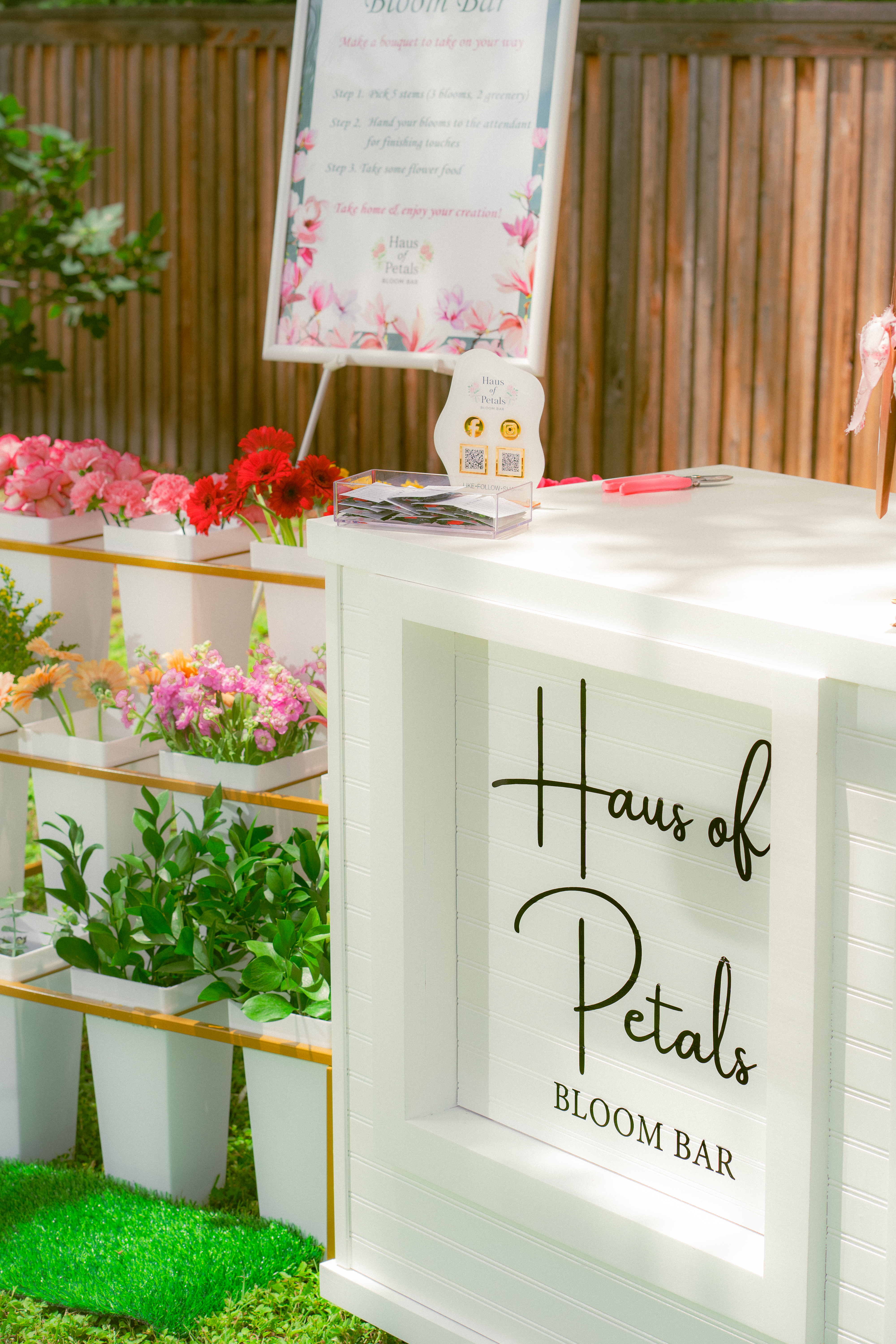 Haus of Petals Bloom Bar hand-lettered sign and flower display, Austin TX